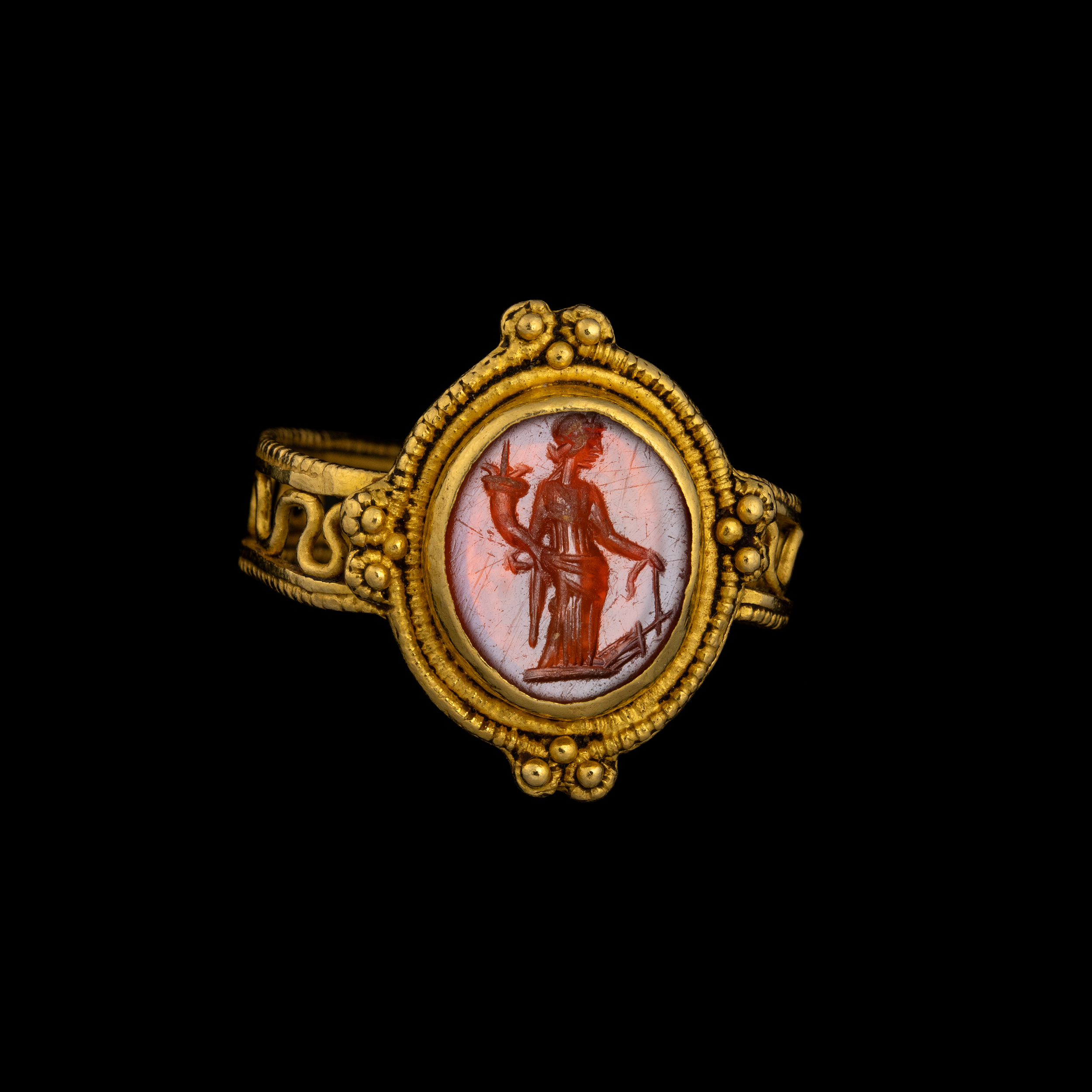 A Late Roman gold ring set with a carnelian intaglio. Tyche. 